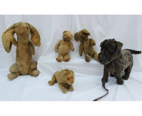 A steiff Lion, with movable limbs and button in his ear together with two mohair teddy bears a hare and a dog