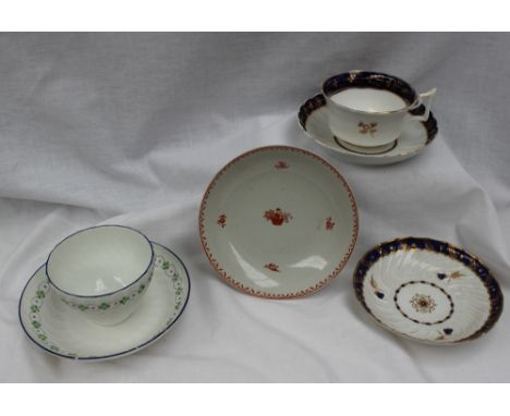 An 18th century Worcester tea cup and saucer with a Royal blue border with gilt floral decoration and gilt thistle to the bas