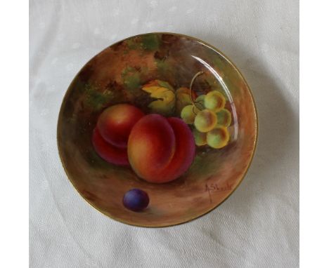 A Royal Worcester porcelain pin tray of circular form painted with peaches and grapes to an ivory ground, signed by Albert Sh