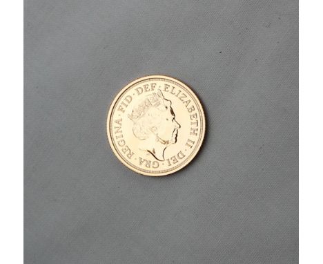 An Elizabeth II gold sovereign dated 2017, this coin signifies the 200th anniversary of the modern sovereign and features a s