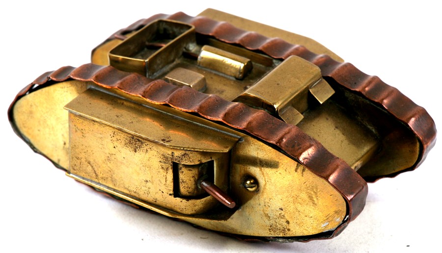 A WW1 brass trench art tank with the tracks made from copper drive ...