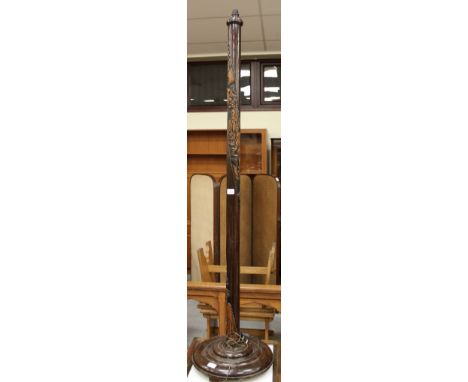 Mahogany standard lamp with carved oriental scenes