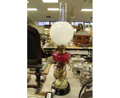 Victorian oil lamp and cranberry shade
