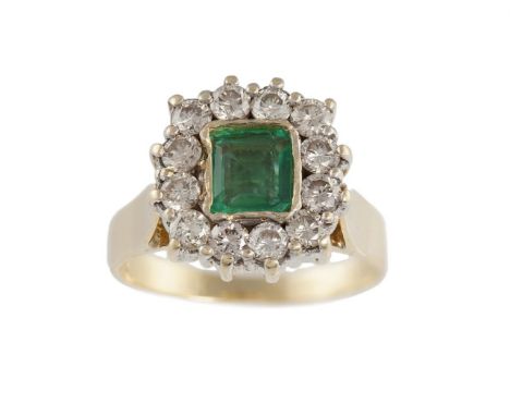 AN EMERALD AND DIAMOND CLUSTER RINGThe cut-cornered step-cut emerald, collet-set within a surround of round brilliant-cut dia