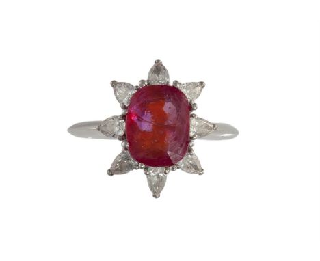 A RUBY AND DIAMOND CLUSTER RINGThe cushion-shaped ruby weighing 3.01cts, in a eight-claw setting, within a pear-shaped diamon