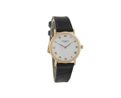 A GOLD SELF-WINDING WRISTWATCH CALATRAVA, BY PATEK PHILIPPE, CIRCA 1991Cal.240, rhodium plated 27 jewel movement adjusted to 