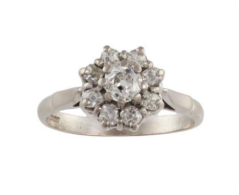 A DIAMOND CLUSTER RINGCentered by an old brilliant-cut diamond, to a surround of old brilliant-cut diamonds, mounted in 18K g