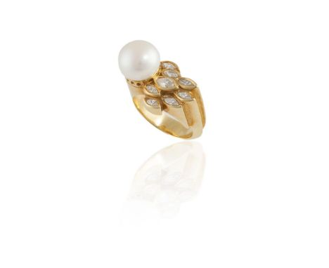 A CULTURED PEARL AND DIAMOND RINGThe button-shaped cultured pearl measuring approximately 11.40mm, set to the side of a taper