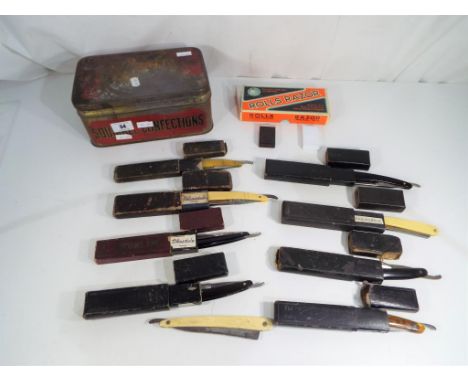 A vintage Squirrel Confections tin containing a boxed Rolls Razor, a quantity of vintage Gillette razor blades and nine vinta