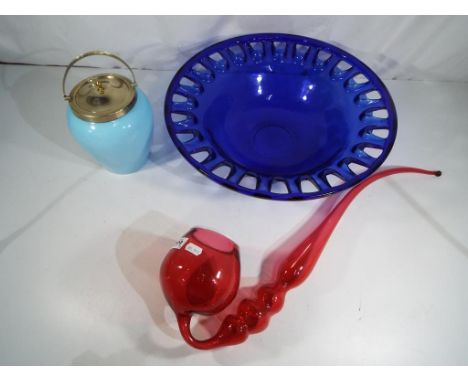 A large blue glass bowl, a piece of red art glass in the style of a pipe and a blue glass biscuit barrel with plated lid (3) 