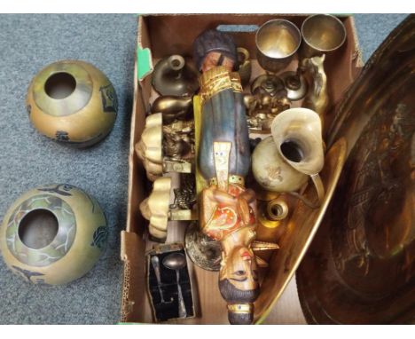 A good lot to include a quantity of brassware comprising goblets, figurines, two fire dogs in the form of lions and two globu