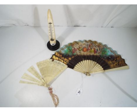 A late 19th century ivory tusk mounted on a wooden stand with inset thermometer, a bone and paper fan and one further fan (3)