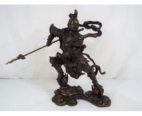 A Chinese bronze sculpture depicting Nezha, approximately 25 cm (h). Est £40 - £60 - This lot MUST be paid for and collected,