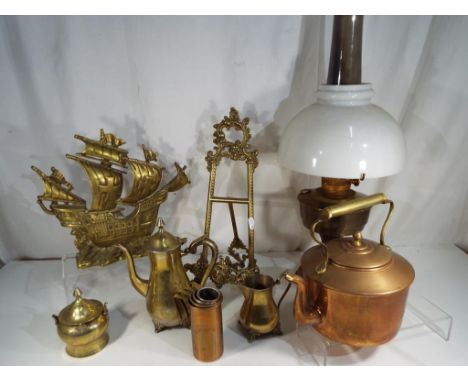 A collection of ornamental copperware and brassware to include an oil lamp, kettle, graduated measures and other [qty] - Est 