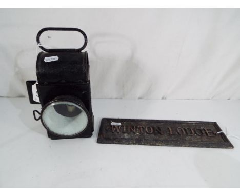 Railwayana - A railway lamp and cast iron wall plaque "Winterton Lodge" (2) - This lot MUST be paid for and collected, or del