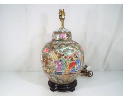 A late 19th century Chinese ginger jar converted to a lamp, hand-painted in the famille vert palate depicting courtiers on a 