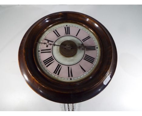 A late 19th century Black Forest 'Postman's Alarm' wall clock, stained beech bezel with pink and white glass dial, Roman nume