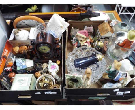 Two boxes containing a large mixed lot to include mantel clock, a Tiffany style table lamp, figurines, large good quality hea