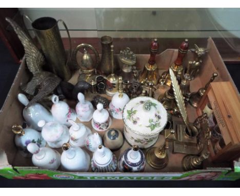 A good mixed lot of ornamental brass ware to include bells, candlesticks and an inkwell, also included in the lot is a bronze