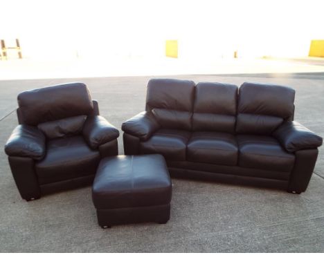 A good quality modern brown leather three seater settee and matching single seater armchair and pouffe Est £60 - £100 - This 