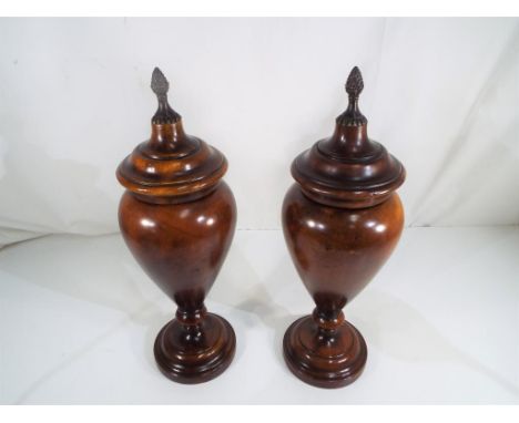 A pair of vintage fruit wood lidded urns 41cm (h) Est £60 - £80 - This lot MUST be paid for and collected, or delivery arrang