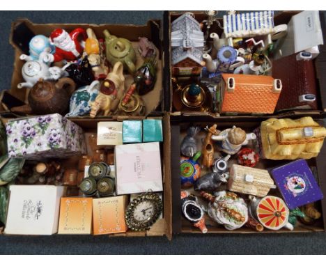 Four boxes comprising novelty teapots, biscuit jars, clocks, ceramic spice jars and similar. (4) - This lot MUST be paid for 