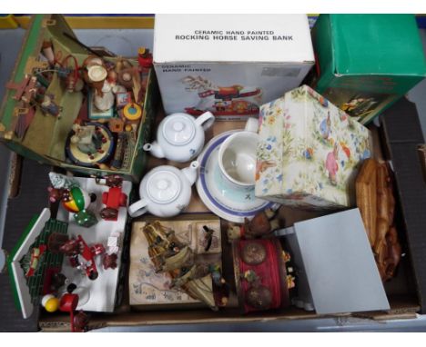 A good lot to include a plated Christening set, Wedgwood Peter Rabbit ceramics, ceramic money bank in the form of a rocking h