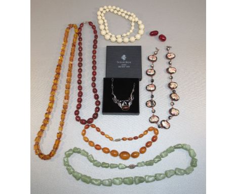 CHINESE GREEN HARDSTONE BEAD NECKLACE WITH SILVER GILT FILIGREE CLASP, THREE AMBER COLOURED BEAD NECKLACES, SILVER COLOURED P