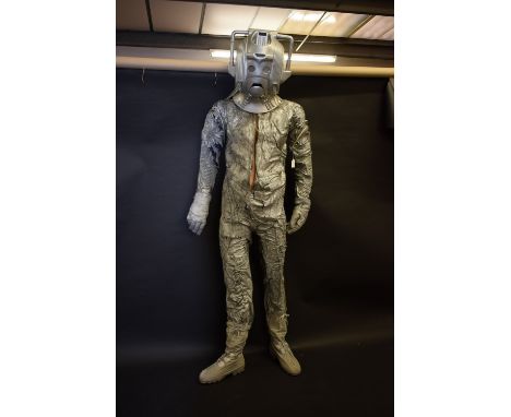Doctor Who - a full size Cyberman costume and head piece, mounted for display on a mannequin, 198cm high overallThis costume 