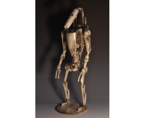 Movie Props - a one-off metal sculpture, of a Star Wars Droid soldier, standing, circular base, signed Rooster, 37.5cm high