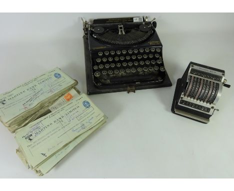 Vintage Remington compact portable typewriter, Resulta-BS9 calculator and a collection of mid 20th Century cheques    Conditi