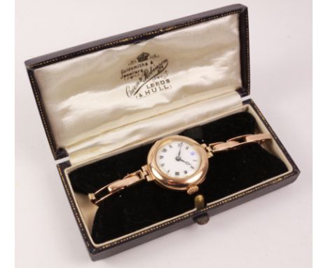 Early 20th century hallmarked 9ct gold enamel face wristwatch the expanding bracelet dated 12 Dec 1921 stamped 9ct approx 20g