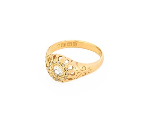 An 18 Carat Gold Diamond Cluster Ring, an old cut diamond within a border of rose cut diamonds, in yellow claw settings, to a
