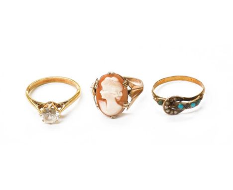 An 18 Carat Gold Cubic Zirconia Solitaire Ring, finger size N1/2; A Turquoise and Seed Pearl Buckle Ring, finger size O; and 