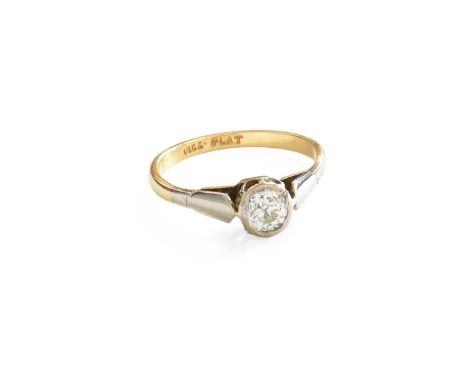 A Diamond Solitaire Ring, the old cut diamond in a white rubbed over setting, to a yellow tapered shoulder plain polished sha