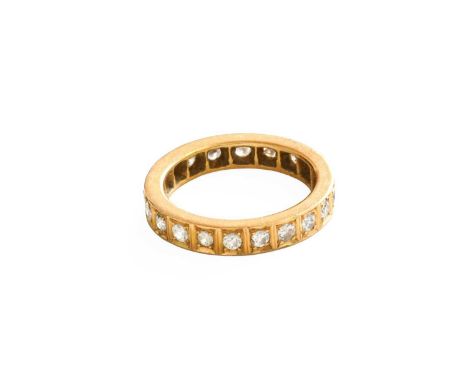 A Diamond Eternity Ring, the round brilliant cut diamonds in yellow square claw settings, total estimated diamond weight 0.80