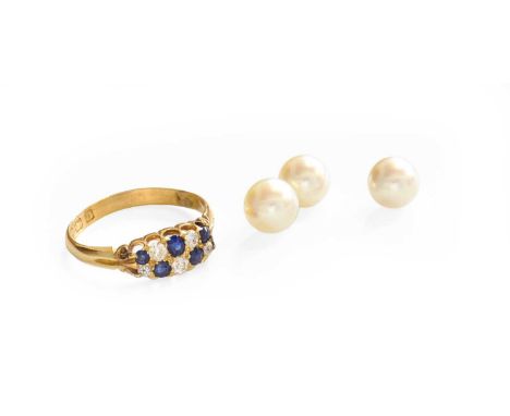 An 18 Carat Gold Sapphire and Diamond Cluster Ring, finger size R1/2; and Three Loose Cultured PearlsRing - 3.0 grams. Cultur