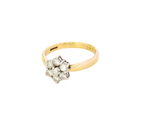 A 9 Carat Gold Diamond Cluster Ring, the central raised round brilliant cut diamond within a border of round brilliant cut di