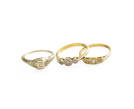 A Diamond Three Stone Ring, stamped '18CT', finger size L; A Diamond Three Stone Ring, stamped '18ct' and 'PT', finger size N
