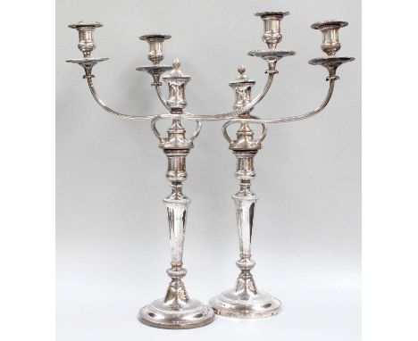 A Pair of Old Sheffield Plate Three-Light Candelabra, each on circular gadrooned base, the tapering stems terminate in detach