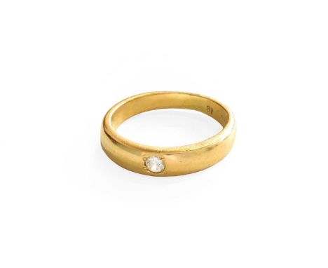 A Diamond Solitaire Ring, the yellow plain polished band inset with a round brilliant cut diamond, estimated diamond weight 0