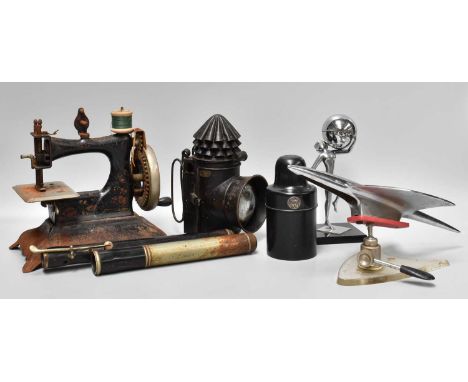 A Tray of Collectables, including: an art deco figural table lighter, a quantity of lace bobbins, a German tinplate child's s