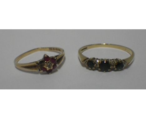 A THREE STONE DRESS RING on a 9ct yellow gold shank, ring size S and one other (def) ring (2)