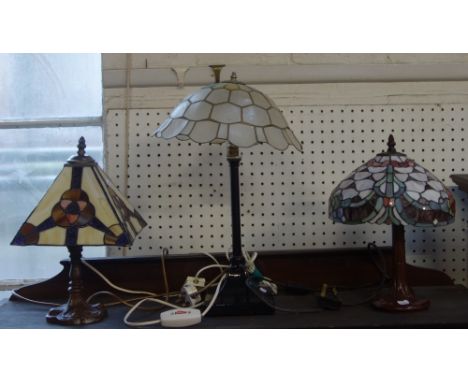 A TIFFANY STYLE LAMP with multi-coloured shade and two similar (3)