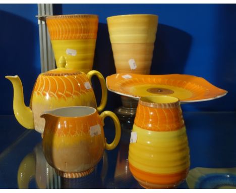 SHELLEY; A COLLECTION OF BRIGHTLY HAND PAINTED ORANGE CERAMICS to include three vases, a teapot, milk jug and cake stand (6)