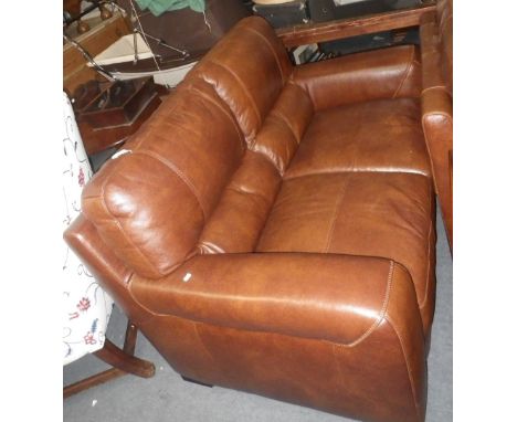 A MODERN LEATHER TWO SEATER SOFA and matching chair