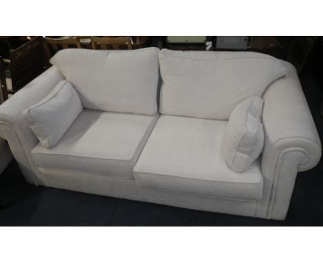 A CONTEMPORARY MULTI-YORK TWO SEATER SOFA, with cream upholstery, 205cm wide