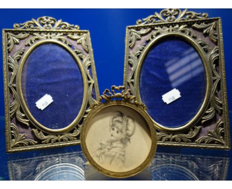 19TH CENTURY HAND DRAWN PORTRAIT MINIATURE, depicting a young girl wearing a bonnet and scarf, in a gilt metal circular frame