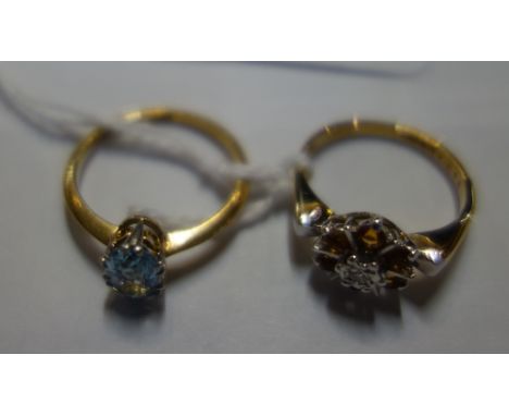 A CITRINE AND DIAMOND CLUSTER RING on an 18ct yellow gold shank, ring size K and one other "aquamarine" ring on an 18ct yello