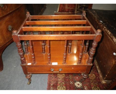A 19TH CENTURY MAHOGANY CANTERBURY with ring turned spindles, 51cm wide